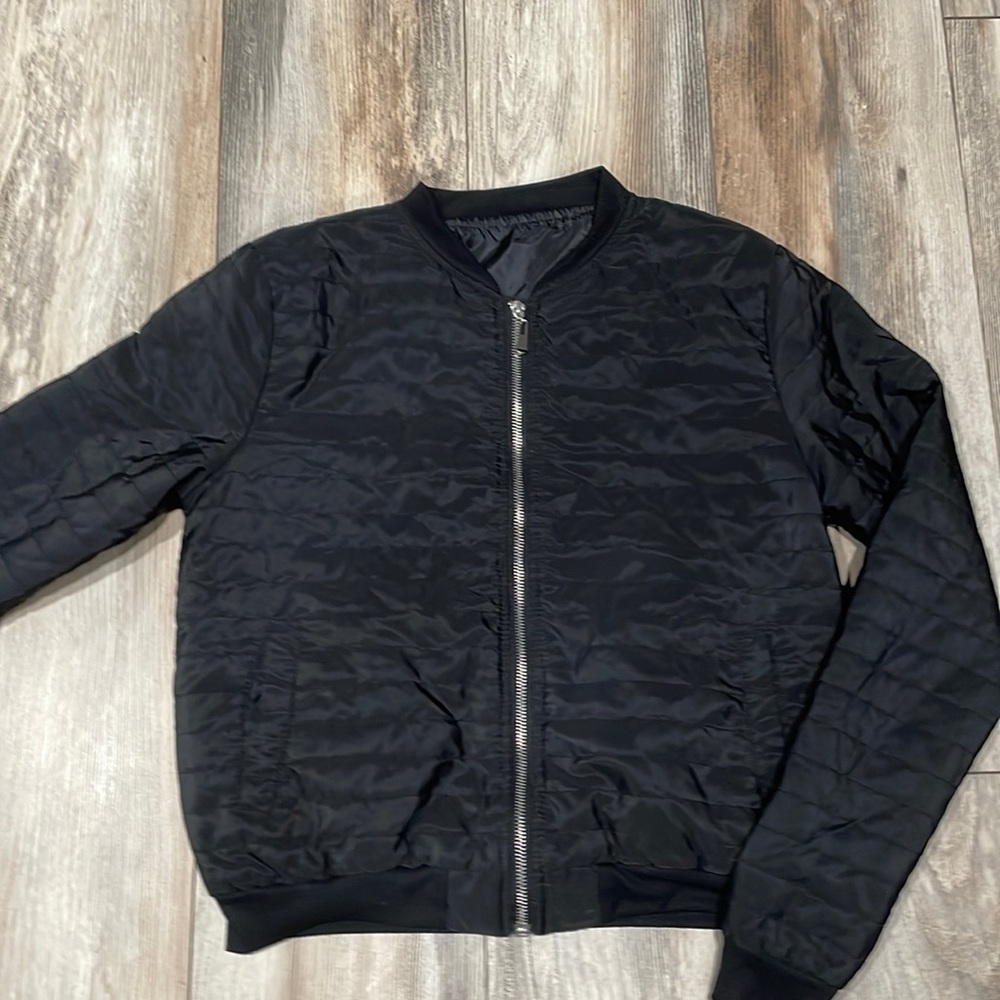 Black bomber jacket with silver decal.